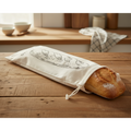 Baguette dans le sac BREAD BAG sur un plan de travail